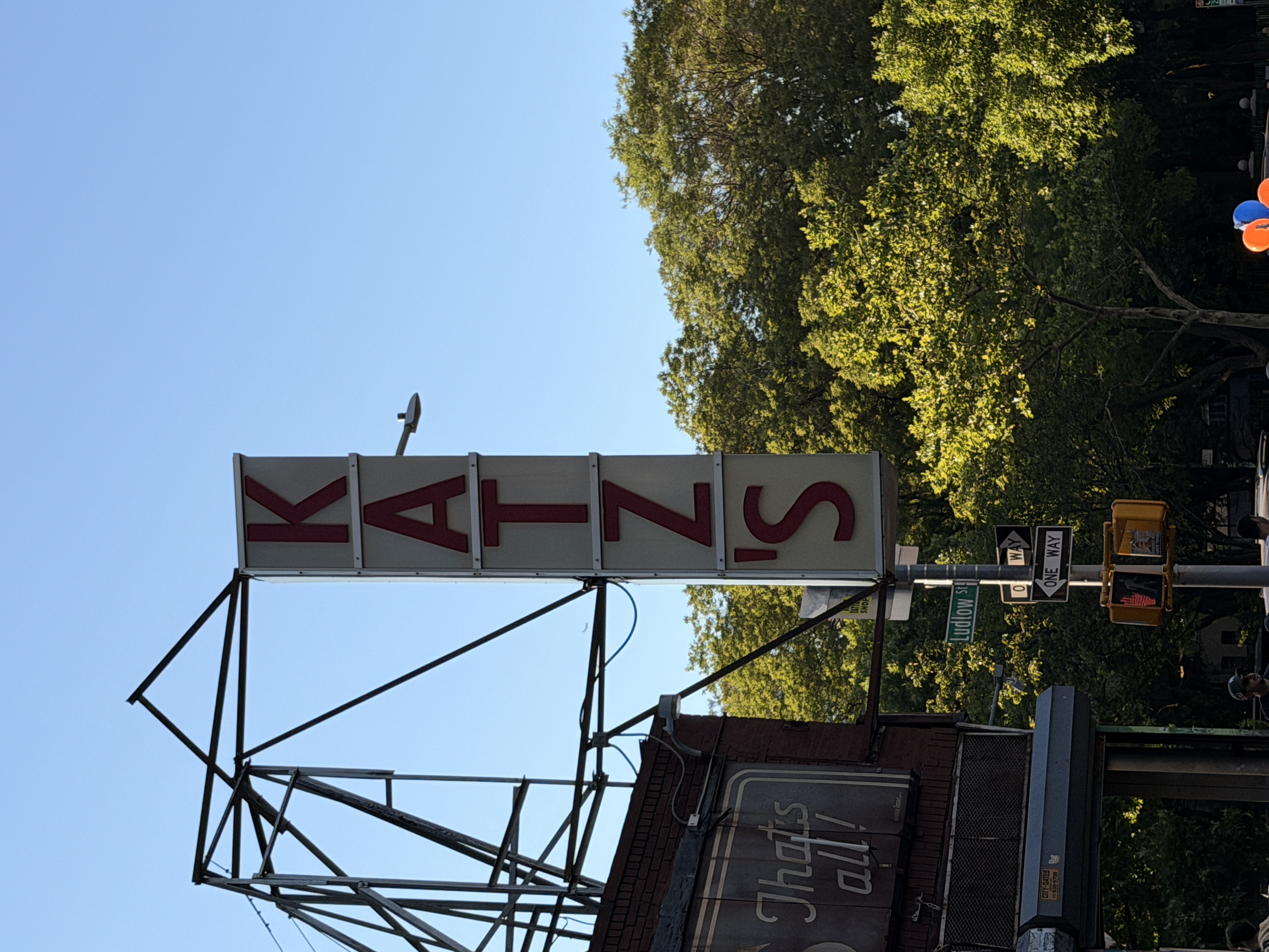 Katz's Delicatessen sign against a clear sky on Ludlow St