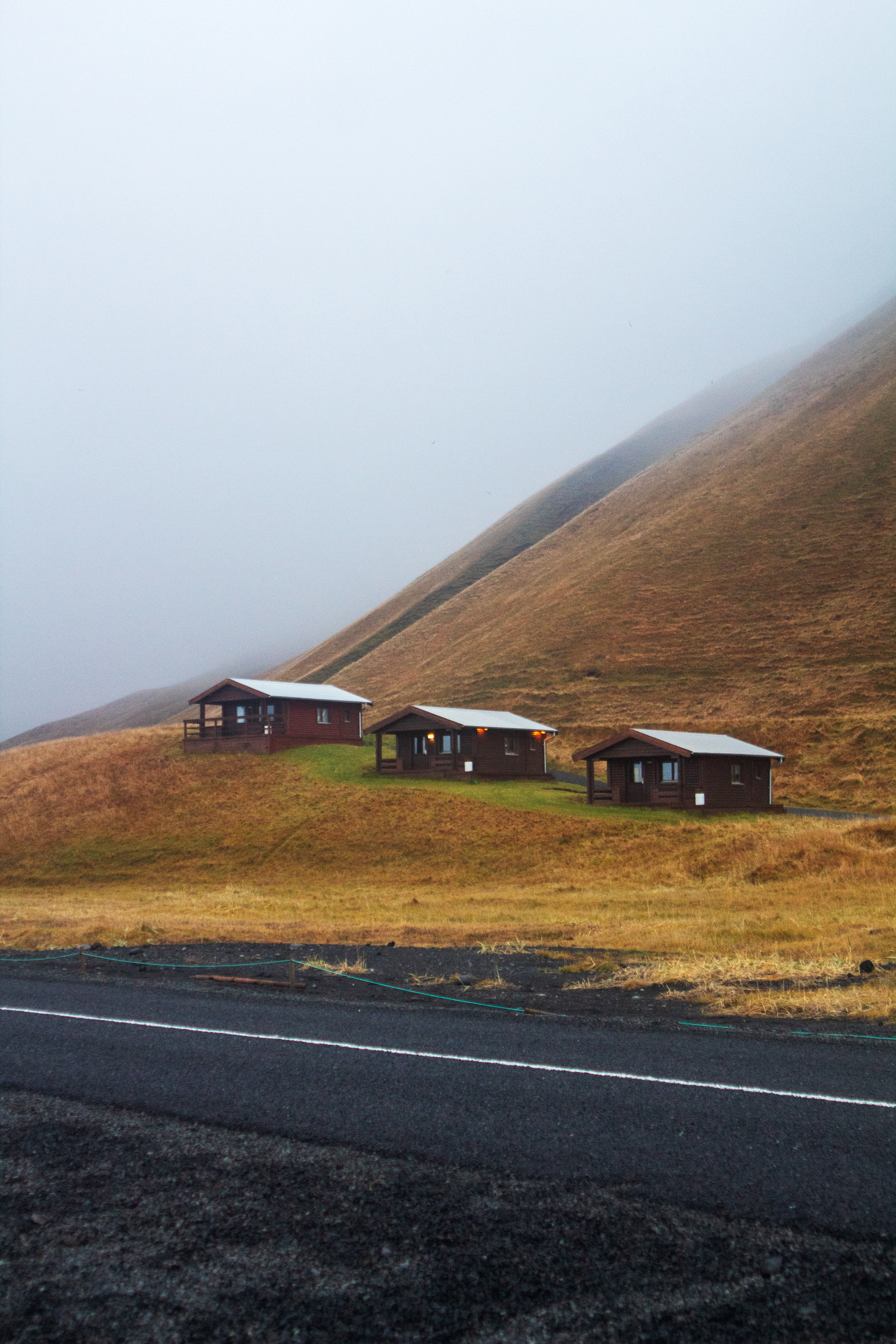 Hillside cabins in fog