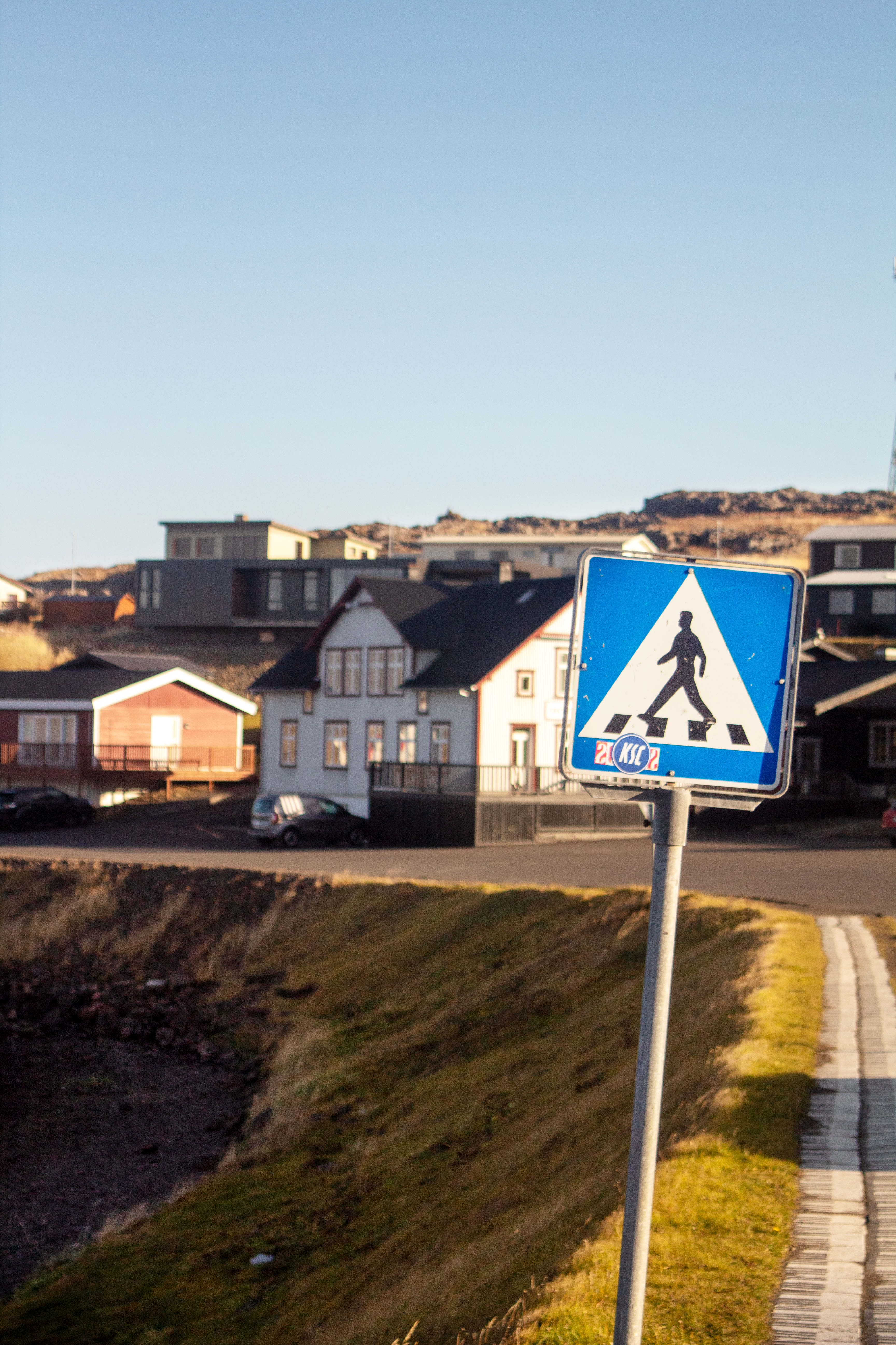 Crosswalk sign and village