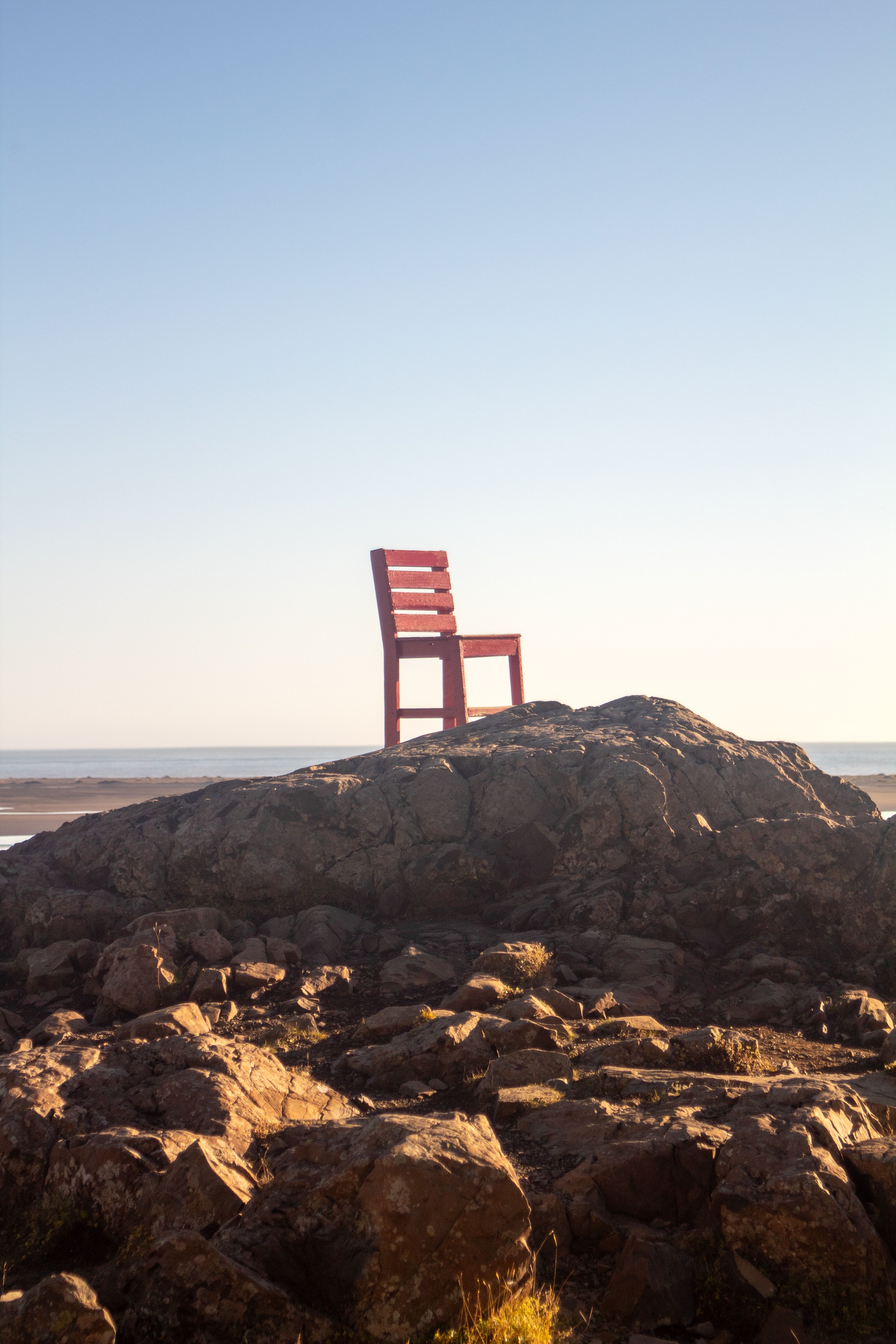 Red chair on rocks
